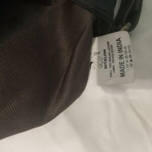 Leather Estalon bag long adj strap. Front 2 zip opening.